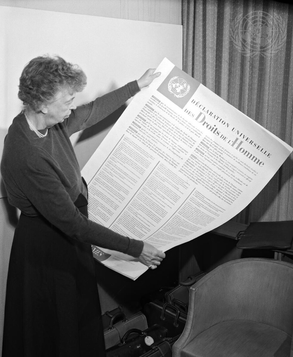 Eleanor Roosevelt looks over the Universal Declaration of Human Rights.